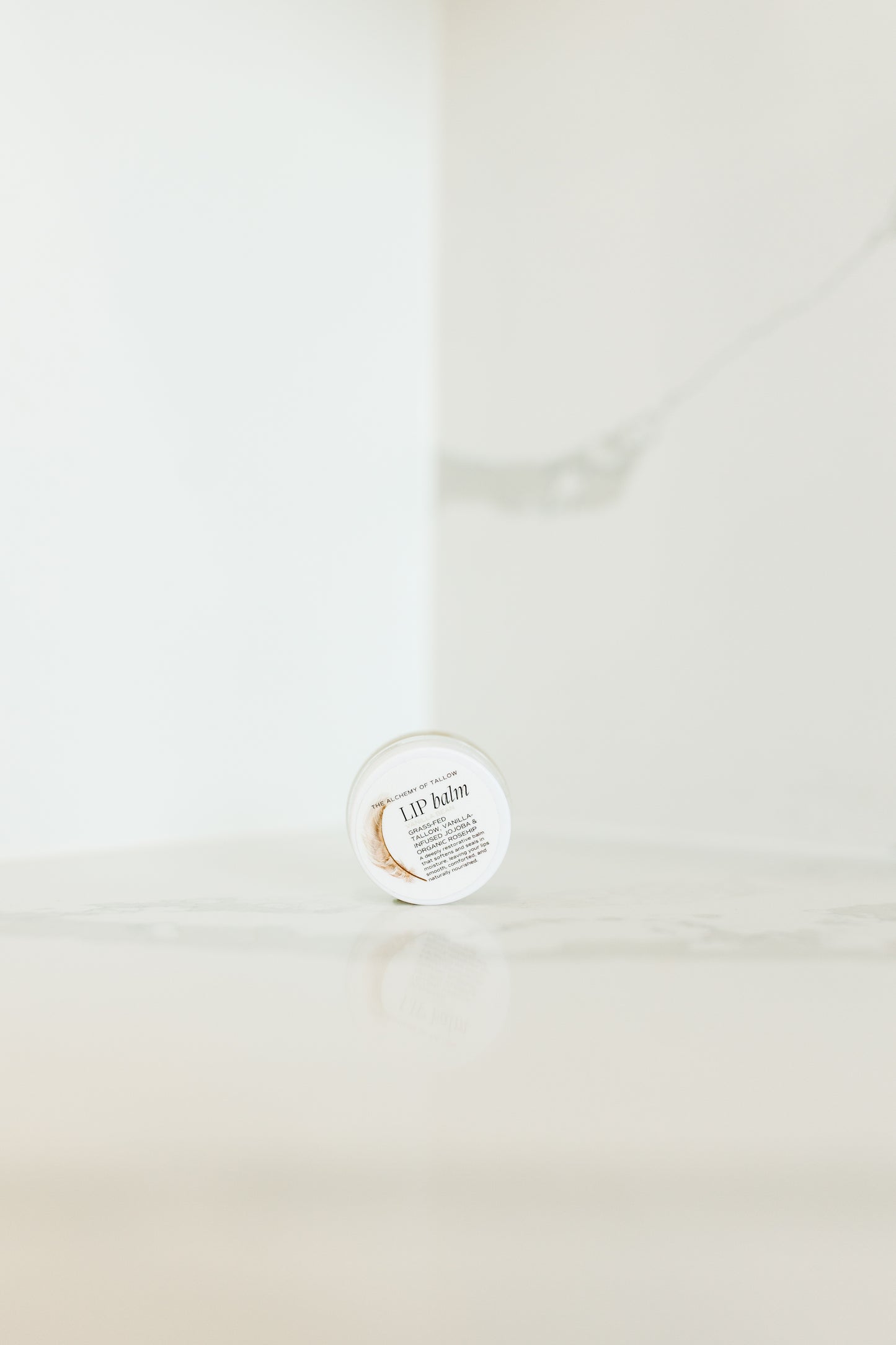 Jar of lip balm on a white background