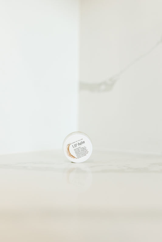 Jar of lip balm on a white background